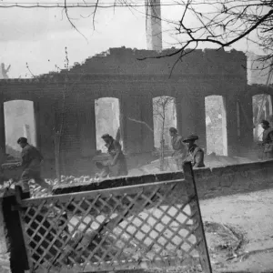 A section of D'Company 4th K. S. L. I. clearing a street in the town of A section of D'Company 4th K. S. L. I. clearing a street in the town of