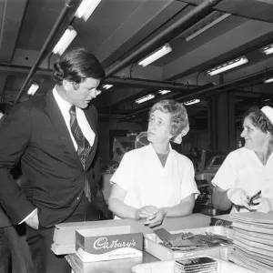 Senator Edward Kennedy seen here chatting to two of the Cadbury work force during his