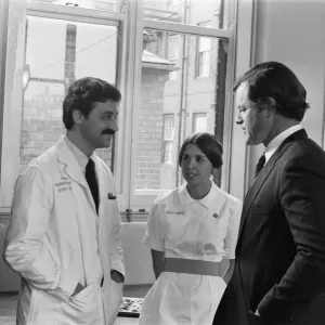Senator Edward Kennedy seen here speaking to nurse Katherine Delk (centre