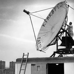 Senior resource technician Mr John Hetherington adjusts the transmitter on the roof of Senior resource technician Mr John Hetherington adjusts the transmitter on the roof of