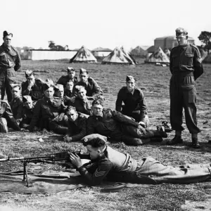 A Sergeant instructor demonstrating to recruits the working of a Bren-Gun A Sergeant instructor demonstrating to recruits the working of a Bren-Gun