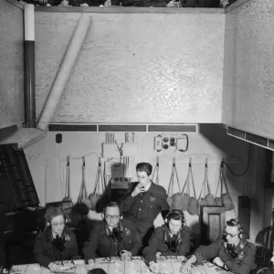 A black and white print of a Royal Observer Corps centre in operation A black and white print of a Royal Observer Corps centre in operation