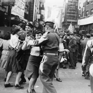 Servicemen and women dancing in the streets of London on VJ Day after Japan surrendered Servicemen and women dancing in the streets of London on VJ Day after Japan surrendered
