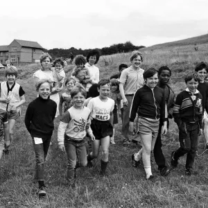 Setting off on a sponsored walk from Rodger Lane are youngsters Setting off on a sponsored walk from Rodger Lane are youngsters