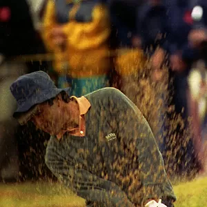 Seve Ballesteros golf player playing shot out of sand trap during the British Open at