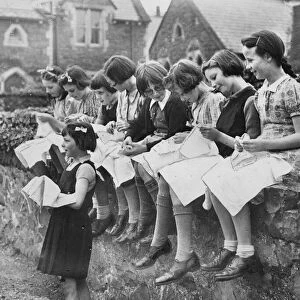 A sewing lesson in the school playground at Llanfairfechan, Conwy County Borough, Wales