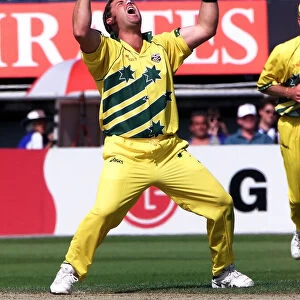 Shane Warne of Australia celebrates after taking a wicket against South Africa in