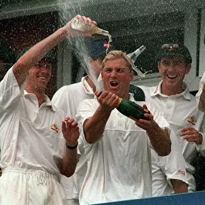Shane Warne celebrates Australias win July 1997 by spraying bottle of
