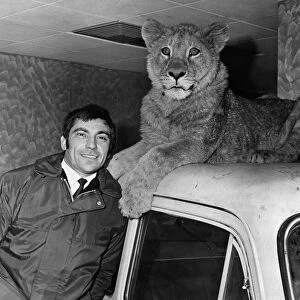 Sheba the lioness with Norman Harvey at his Cardiff garage. March 1969