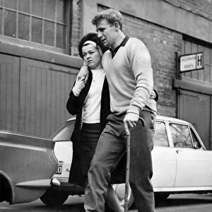 Sheffield Wednesday Hero, Vic Mobley is helped to his car by his pretty wife Barbara