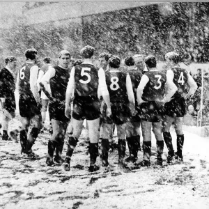 Sheffield Wednesday players gather on the side line at Highbury during their match Sheffield Wednesday players gather on the side line at Highbury during their match