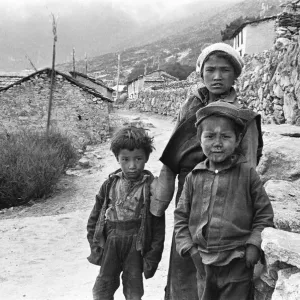 Sherpa children pose in the street of one of the high villages in the SoluKhumbu region