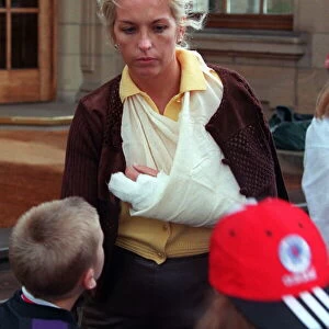 Sheryl Gascoigne with bruised marks made by Gazza wearing bandage sling round arm brown
