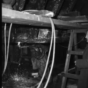 Shipbuilders at the King George V dry dock in Southampton replace damaged hull plates of Shipbuilders at the King George V dry dock in Southampton replace damaged hull plates of