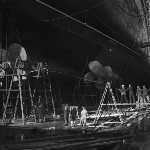 Shipbuilders at the King George V dry dock in Southampton replace one of the mighty Shipbuilders at the King George V dry dock in Southampton replace one of the mighty