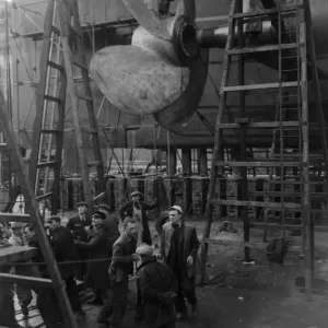 Shipbuilders at the King George V dry dock in Southampton replace one of the mighty Shipbuilders at the King George V dry dock in Southampton replace one of the mighty