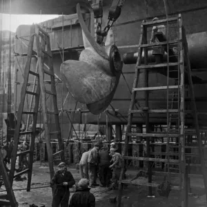 Shipbuilders at the King George V dry dock in Southampton replace one of the mighty Shipbuilders at the King George V dry dock in Southampton replace one of the mighty