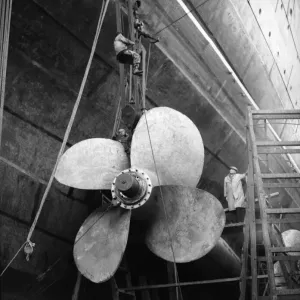 Shipbuilders at the King George V dry dock in Southampton replace one of the mighty Shipbuilders at the King George V dry dock in Southampton replace one of the mighty