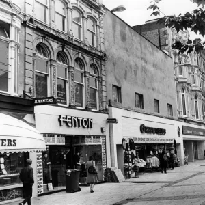 Print of Queen Street shop frontages in Cardiff, Wales, 1984 Print of Queen Street shop frontages in Cardiff, Wales, 1984