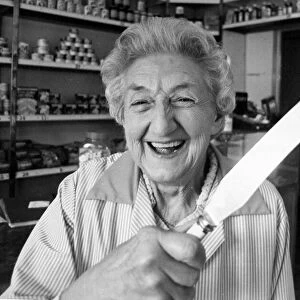 Shopkeeper Dorothy Gleave holding a knife that she used to chase away two armed teengaers