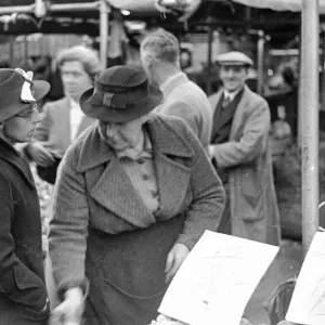 Shoppers at the green grocers stall in Kingston Market. Circa 1936