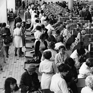 Shoppers at the tills at Sainsburys supermarket in Trinity Street, Coventry
