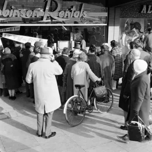 Shoppers watch Sir Winston Churchill state funeral through shop window of Robinson Shoppers watch Sir Winston Churchill state funeral through shop window of Robinson