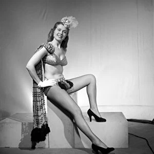 Showgirl wearing bikini with tartan sash fancy dress for hogmanay. 1959