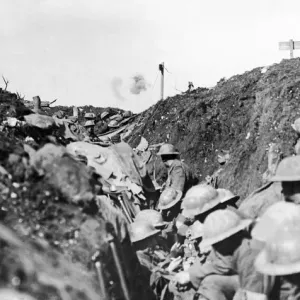 Shrapnel bursting over Canadian troops sheltering in a reserve trench during