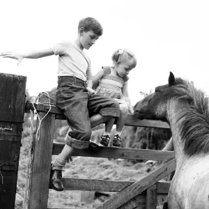 Siblings, Helen (3) and Paul Burrows (9) from Waterloo, London