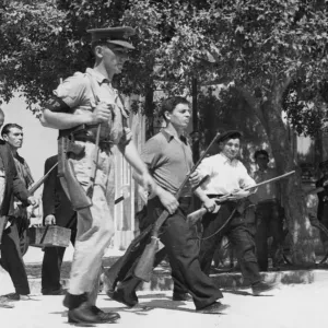 Sicilian civilians hand over arms to British soldiers. 17th August 1943 Sicilian civilians hand over arms to British soldiers. 17th August 1943