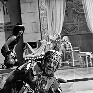 Sid James on the set of "Carry on Cleo"at Pinewood Studios, Buckinghamshire