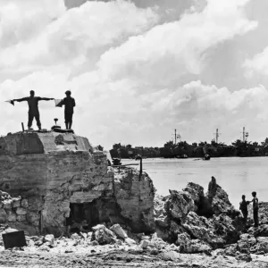 US Signalman directs landing ships off Okinawa Beach. A US Navy Signalman US Signalman directs landing ships off Okinawa Beach. A US Navy Signalman