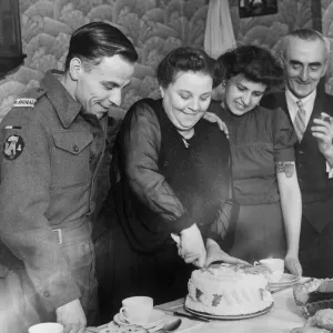 Signalman in the Royal Navy Andrew Cambpell about to eat a cake made for him by his
