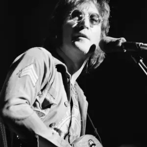 Former singer of The Beatles pop group John Lennon pictured performing on stage during Former singer of The Beatles pop group John Lennon pictured performing on stage during