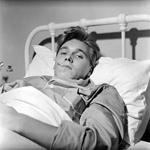 Singer Billy Fury in bed at a Cambridge Nursing Home, following his collapse in a taxi in