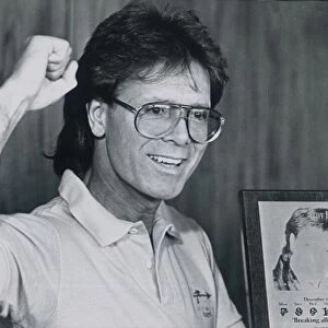 Singer Cliff Richard (47) picks up an award for playing a record 6 consecutive nights of