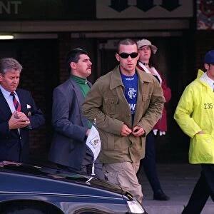 Singer composer Robbie Williams leaves Ibrox after a game wearing a Rangers shirt