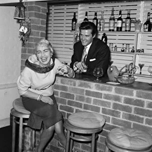 Singer Dorothy Squires with her husband, actor Roger Moore. 14th March 1958