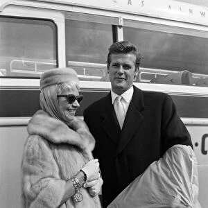 Singer Dorothy Squires returning home from the USA with her husband, actor Roger Moore