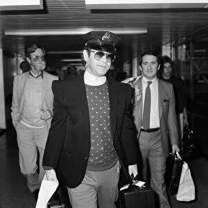 Singer Elton John, arrives at Heathrow airport from his 10 week tour of the States