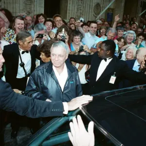 Singer Frank Sinarta is mobbed by waiting fans as he arrives at the Royal Albert Hall to Singer Frank Sinarta is mobbed by waiting fans as he arrives at the Royal Albert Hall to