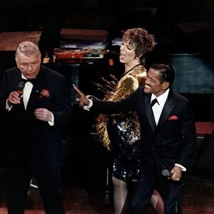 Singer Frank Sinatra on stage with Liza Minnelli and Sammy Davis Jnr performing on stage