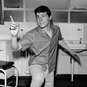 Singer Jess Conrad models a new paper shirt by Teddy Tinling. 12th February 1962