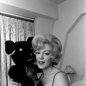Singer Kathy Kirby singer holding a teddy bear. 14th January 1964
