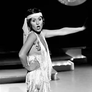 Singer Lulu seen here on the set of her TV show dressed as a 1920s flapper. February 1975