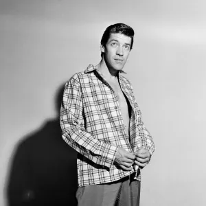 Singer Michael Holliday poses wearing check shirt. 24th November 1957 Singer Michael Holliday poses wearing check shirt. 24th November 1957