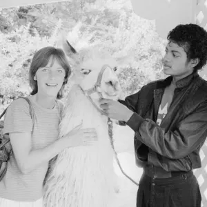 Singer Michael Jackson introduces his pet llama to Daily Mirror competition winner Susan