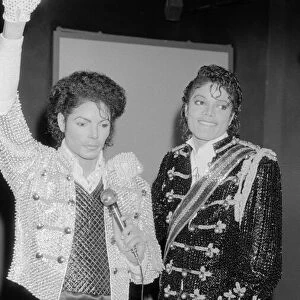 Singer Michael Jackson looking at a waxwork model of himself on display at madame