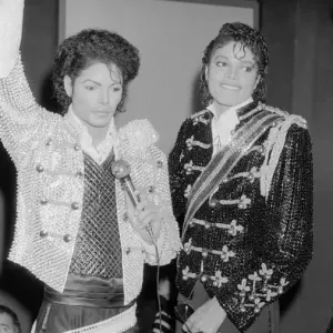 Singer Michael Jackson looking at a waxwork model of himself on display at madame